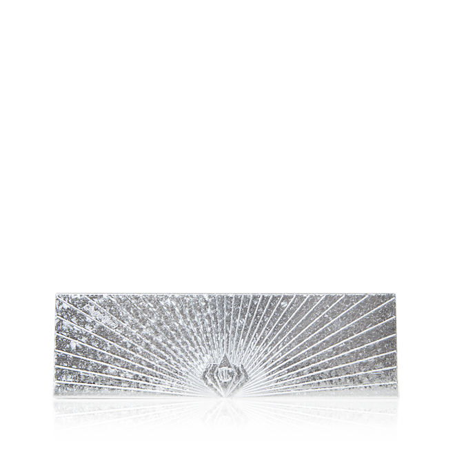Instant Eye Palette in Bejewelled Eyes to Hypnotise closed A closed eyeshadow palette with shimmery, silver-coloured packaging and a starburst pattern on the lid.