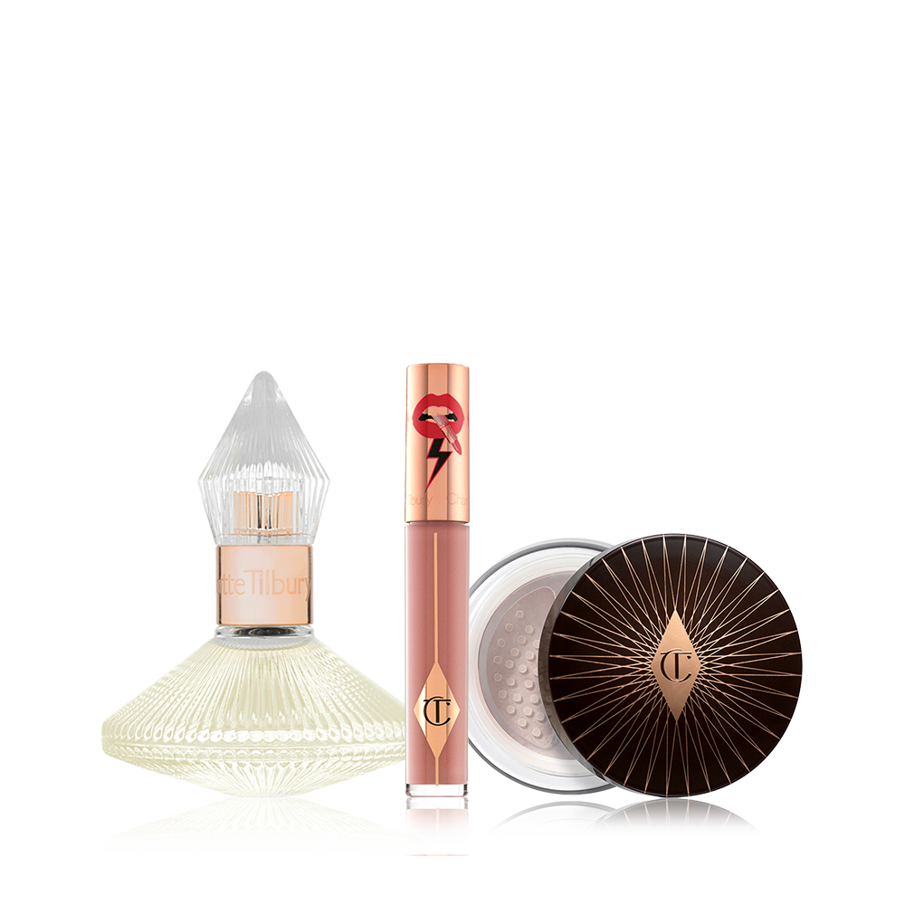 A 100 ml perfume in a glass bottle with with a glass lid with a liquid lipstick in a nude brown shade with a golden-coloured lid, and loose powder with a black and gold-coloured lid. 
