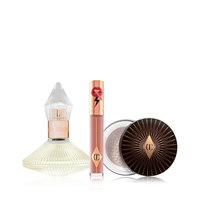A 100 ml perfume in a glass bottle with with a glass lid with a liquid lipstick in a nude brown shade with a golden-coloured lid, and loose powder with a black and gold-coloured lid. 