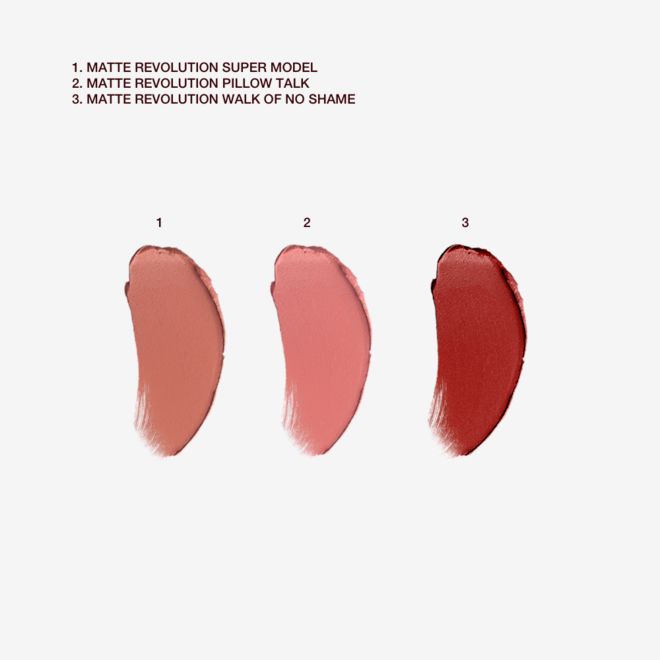 Iconic Mini Lip Trio swatches Swatches of three matte lipsticks in the shades brick-red, nude pink, and peachy-brown.