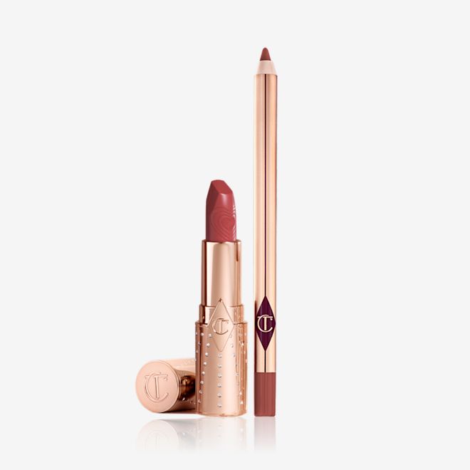 K.I.S.S.I.N.G Lipstick and Lip Cheat Kit An open lip liner pencil in a peachy-pink shade and an open lipstick in a salmon-pink colour in a gold-coloured tube.