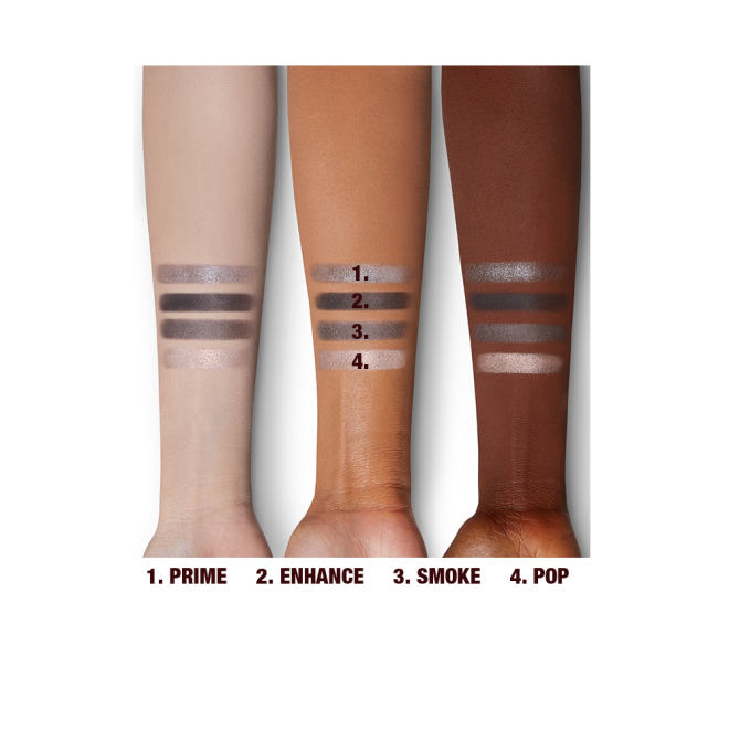 Four eyeshadow swatches in shades of grey, pearl, and silver on light, medium, and deep-tone arms. 