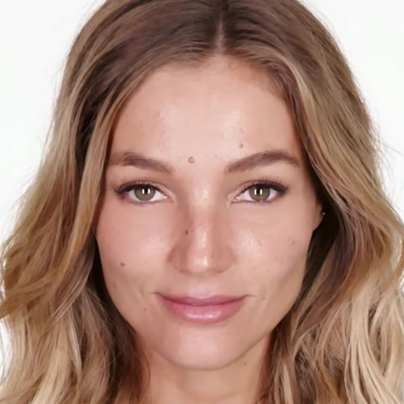 A fair-tone model with glowy skin after wearing an overnight mask for a sun-kissed look.