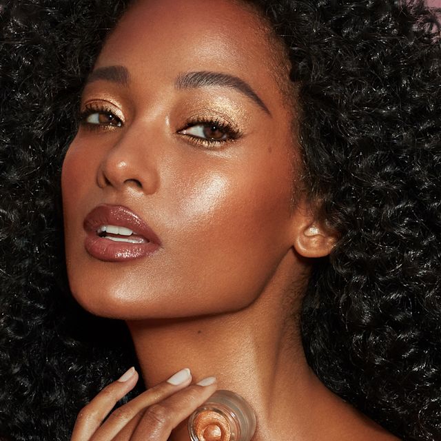 Model wearing a glossy eye makeup look using Eyes to Mesmerise cream eyeshadow