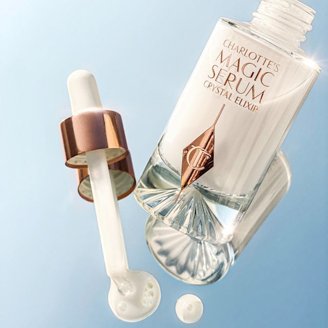 Charlotte's Magic Serum Crystal Elixir releasing drops of face serum