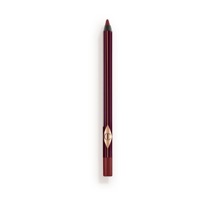 a berry-brown eyeliner pencil with its cap removed. 