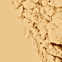 Swatch of a brightening, setting powder compacts in banana yellow.