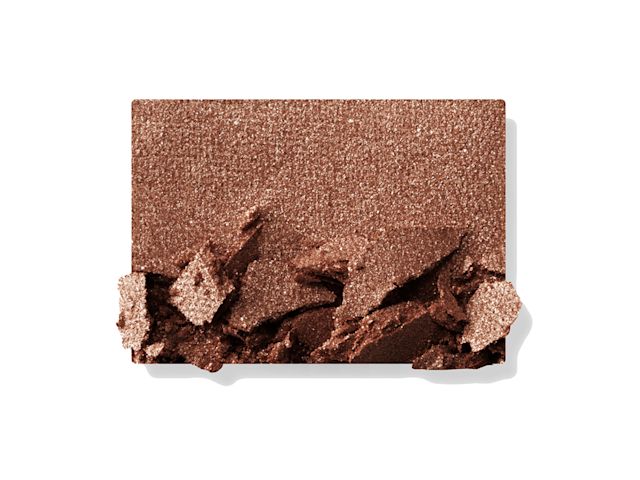 Swatch of a shimmery powder eyeshadow in a dark brown shade. 