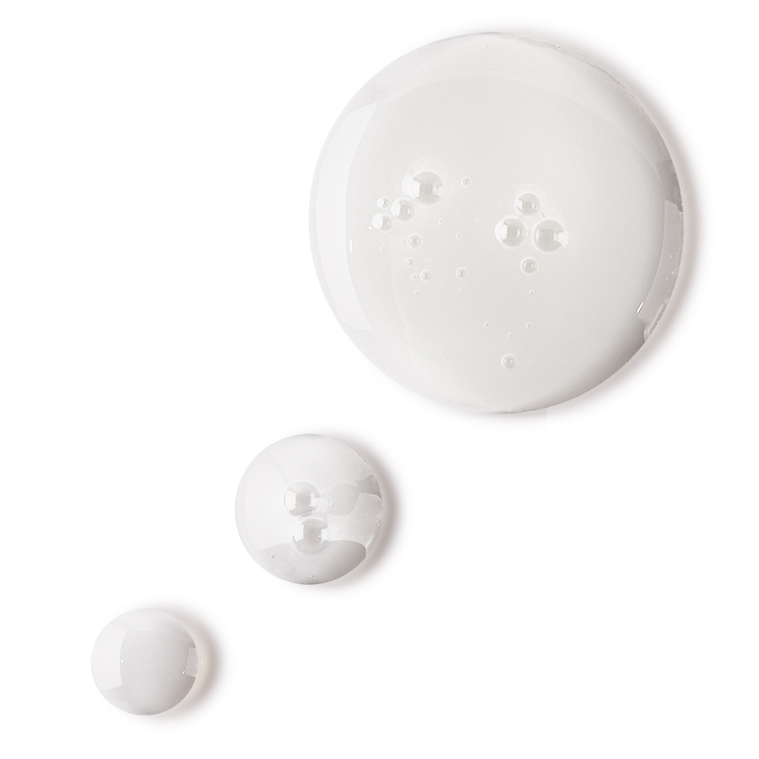 Pearly-white drops of a watery facial toner with a luminous finish.