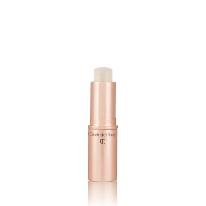 An open, highlighter stick in subtle grey-gold colour with a golden-coloured tube.