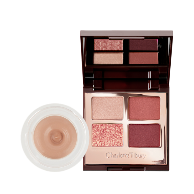 An open eyeshadow pot with a nude cashmere cream shadow with a matte finish inside with its lid next to it, and an open quad eyeshadow palette with a mirrored-lid with matte and shimmery eyeshadows in shades of gold, pink, and plum.