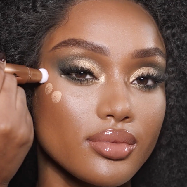 Step 11 in Charlotte's 70s makeup tutorial is to apply golden highlighter to the cheekbones