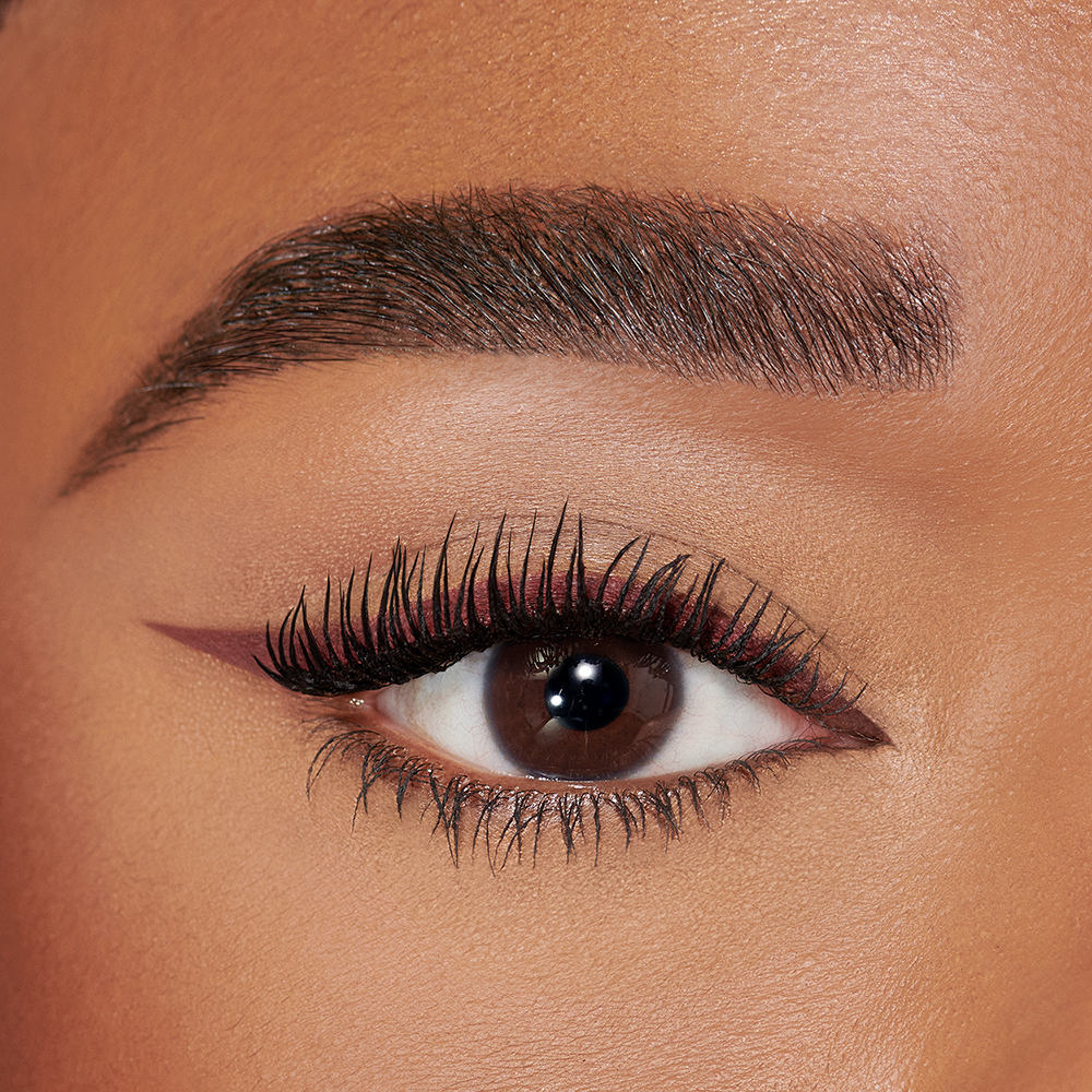 Pillow Talk Push Up Eye Kit on deep skintone model