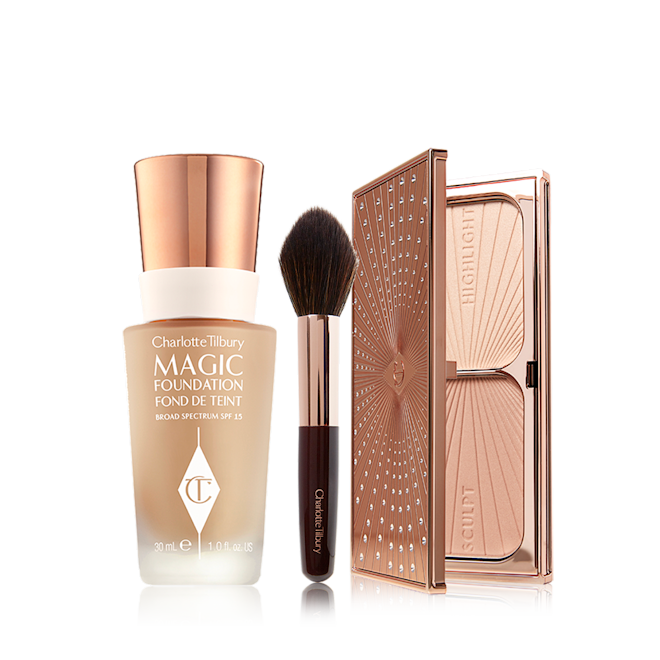 Flawless Bronze and Glow Complexion Kit open Foundation in a frosted glass bottle with a gold-coloured lid, bronzer and blush brush with soft synthetic bristles, and duo contour palette with highlight and bronzing shades in a sleek, gold-coloured compact.