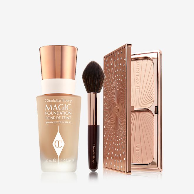 Flawless Bronze and Glow Complexion Kit open Foundation in a frosted glass bottle with a gold-coloured lid, bronzer and blush brush with soft synthetic bristles, and duo contour palette with highlight and bronzing shades in a sleek, gold-coloured compact.