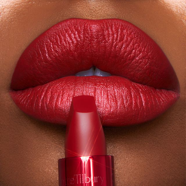 Model wearing Savage Rose and Cinematic Red lip liner and lipstick combination