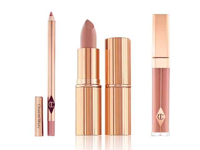 An open, nude-pink lip liner pencil with two lipsticks, one without the lid, in nude pink colour, and a nude pink lip gloss, all in rose-gold colour packaging. 