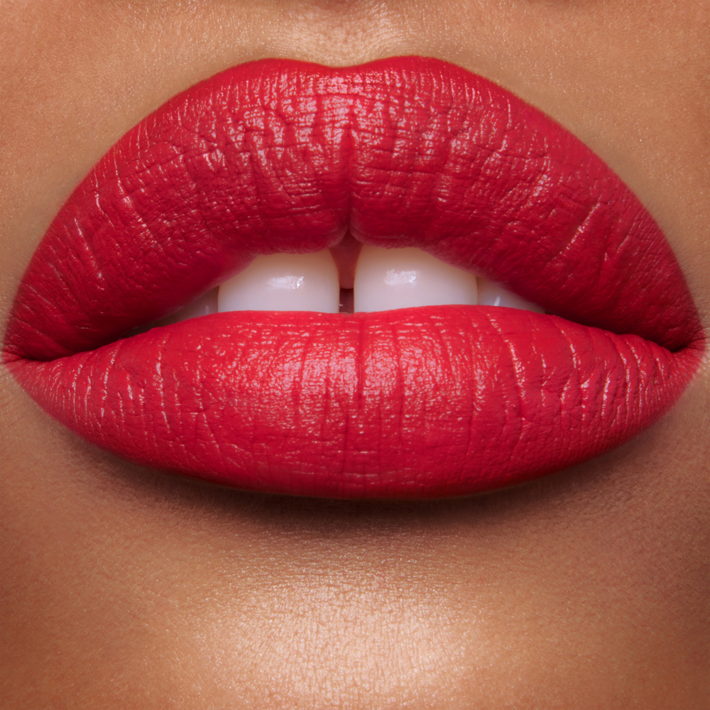 Lip close up of Hollywood Vixen bright-red Matte Revolution lipstick