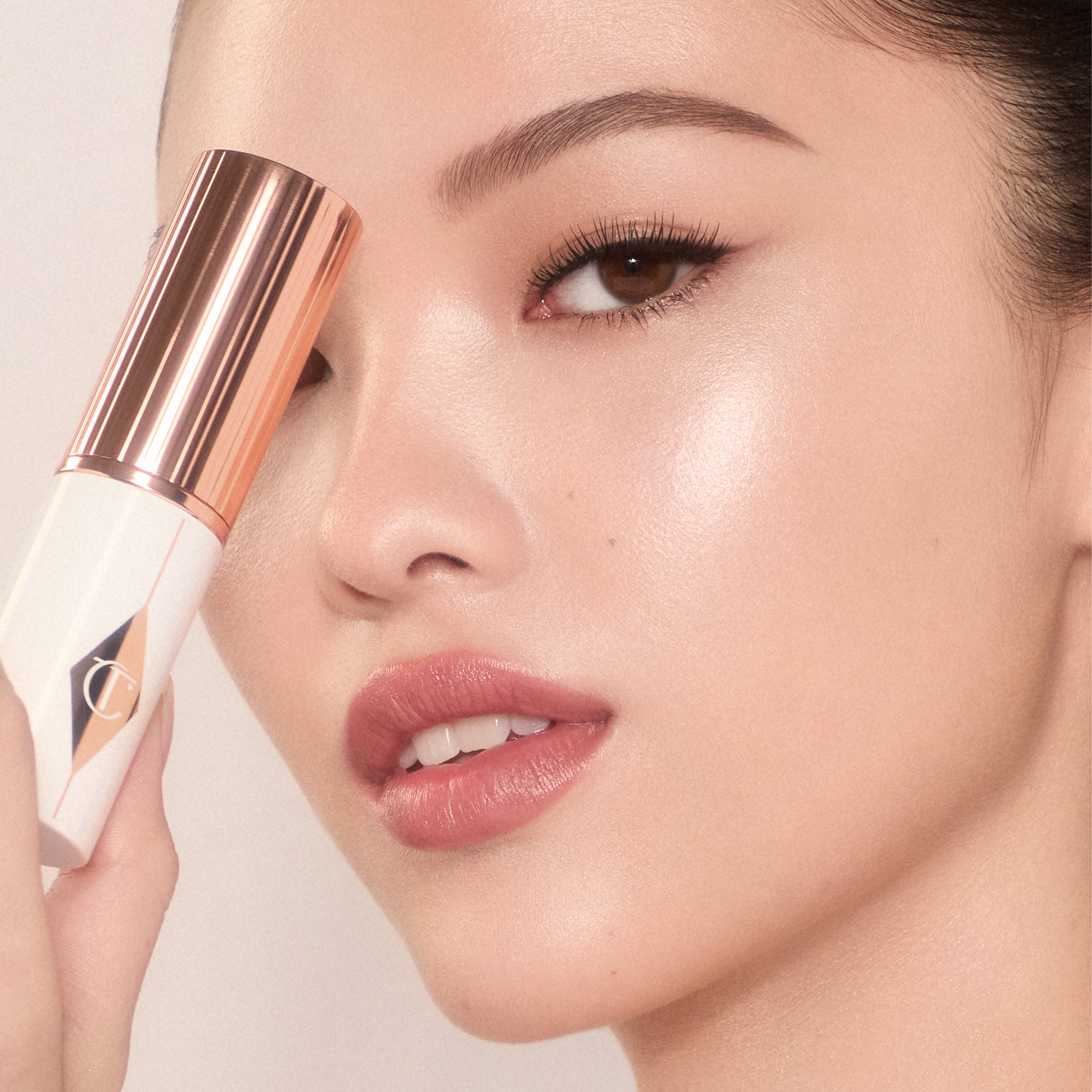 Model wearing Unreal Skin Foundation Stick