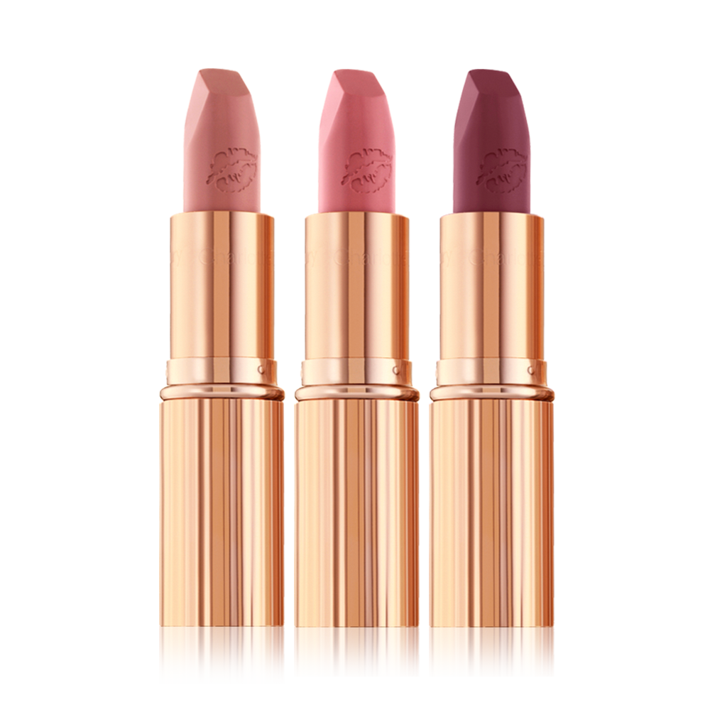 three matte lipsticks with their lids removed in nude peach, tea rose, and purplish-pink colours. 