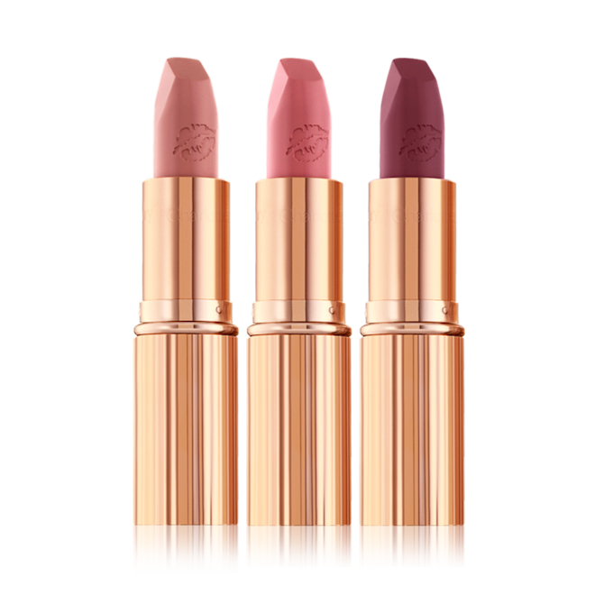 Hot Lips Trio nude open three matte lipsticks with their lids removed in nude peach, tea rose, and purplish-pink colours.