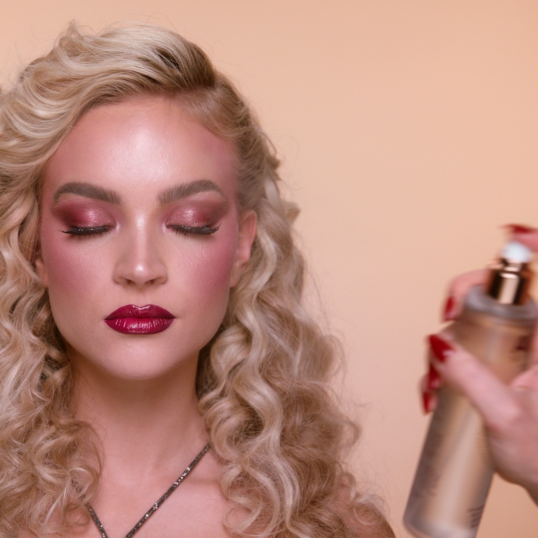 Step 12 in Sofia Tilbury's 80s Makeup Look tutorial: apply setting spray