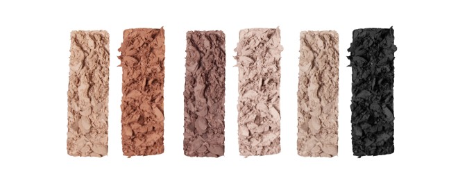 Swatches of six eyeshadows in nude, matte shades of light beige, light sand, fawn, clay-brown, dark brown, and black. 