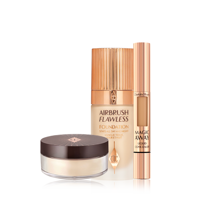 Creamy liquid concealer in a sleek gold-coloured tube with a soft sponge end for application, foundation in a frosted glass bottle with a gold-coloured lid, and loose powder in a light yellow shade in a transparent pot with a black-brown-coloured lid.