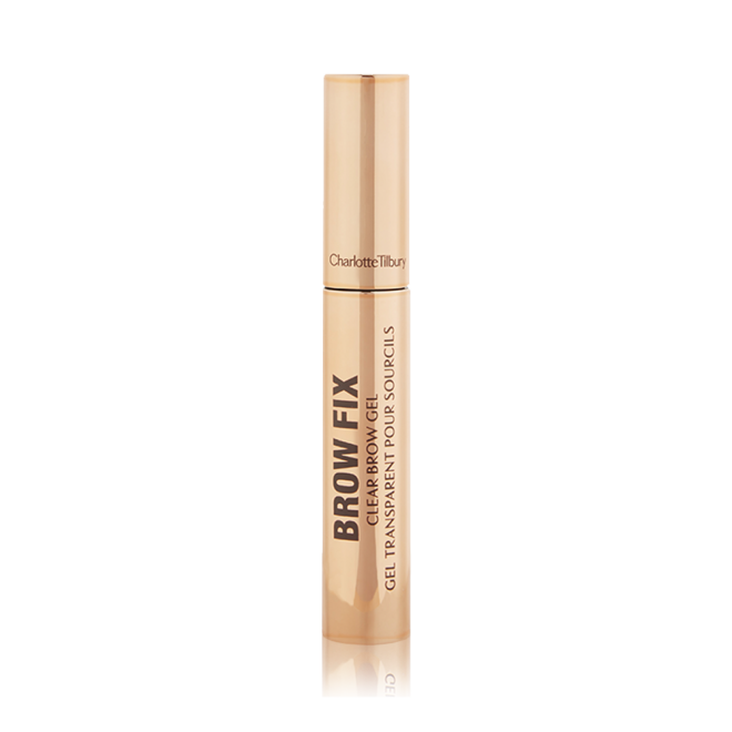 A closed tube of clear, brow-fixing gel with gold-coloured packaging.