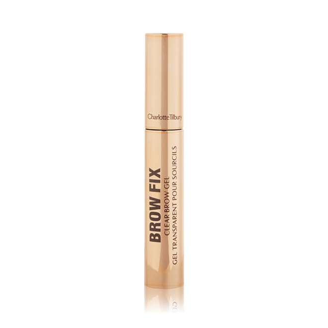 A closed tube of clear, brow-fixing gel with gold-coloured packaging.