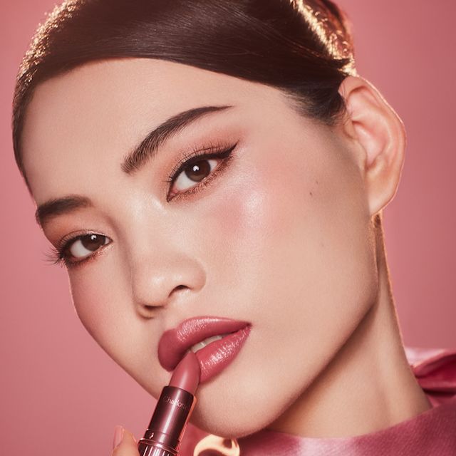 Cheng wearing Hollywood Beauty Icon Lipstick in Rose to Fame as a mauve-rose bridal lipstick
