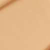 Close-up swatch of a skin-like, glowy foundation in a cool, sandy beige shade.