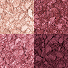 Swatches of four, crushed eyeshadows in shades of pink, plum, and champagne. 