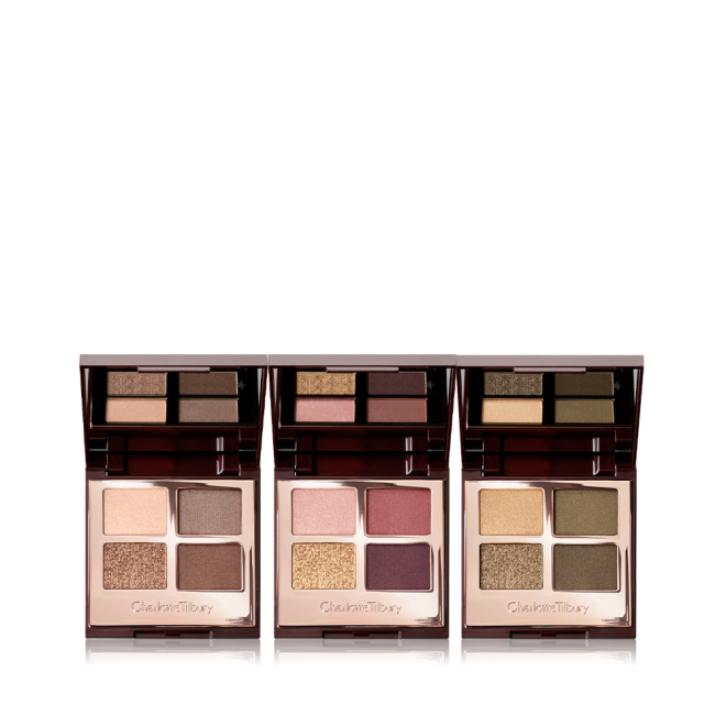 Three, open, quad eyeshadow palettes with mirrored-lids in matte and shimmery gold, beige, brown, red, purple, and green shades.