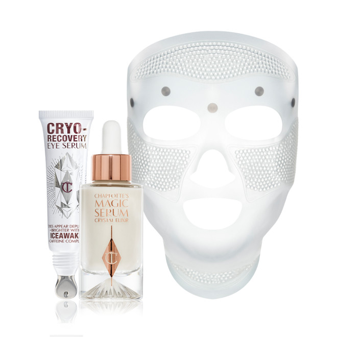 A white-coloured face mask with tiny holes all over the forehead and cheeks area, and large eye, nose, and mouth holes so the mask can comfortably sit on any face size or shape, luminous serum in a glass bottle with a dropper lid, and an open white-coloured eye serum tube with silver-colour geometric patterns on the front and text written on it that reads, 'eye appear depuffed and brighter with Iceawake, caffeine complex'