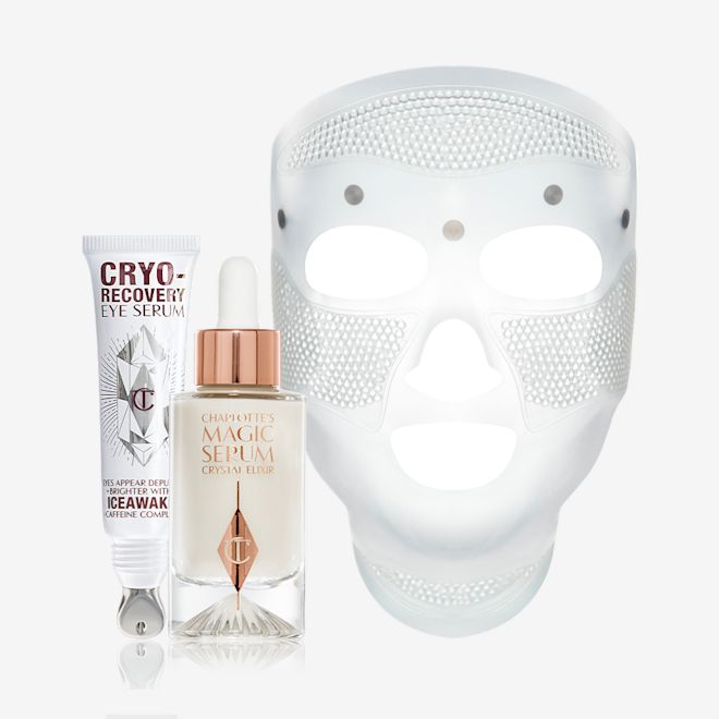 Cyro-Recovery and Magic Serum bundle A white-coloured face mask with tiny holes all over the forehead and cheeks area, and large eye, nose, and mouth holes so the mask can comfortably sit on any face size or shape, luminous serum in a glass bottle with a dropper lid, and an open white-coloured eye serum tube with silver-colour geometric patterns on the front and text written on it that reads, 'eye appear depuffed and brighter with Iceawake, caffeine complex'