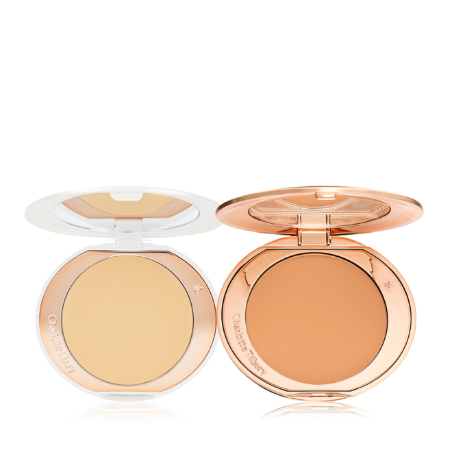 Two, open, setting powder compacts with mirrored-lids and white and gold-coloured packaging, in banana yellow and clay-brown shades.