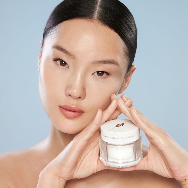 Fair skin tone model holding Magic Water Cream Fair skin tone model holding Magic Water Cream