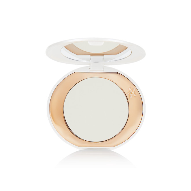 A miniature compact brightening powder in a white shade for fair and medium skin tones.