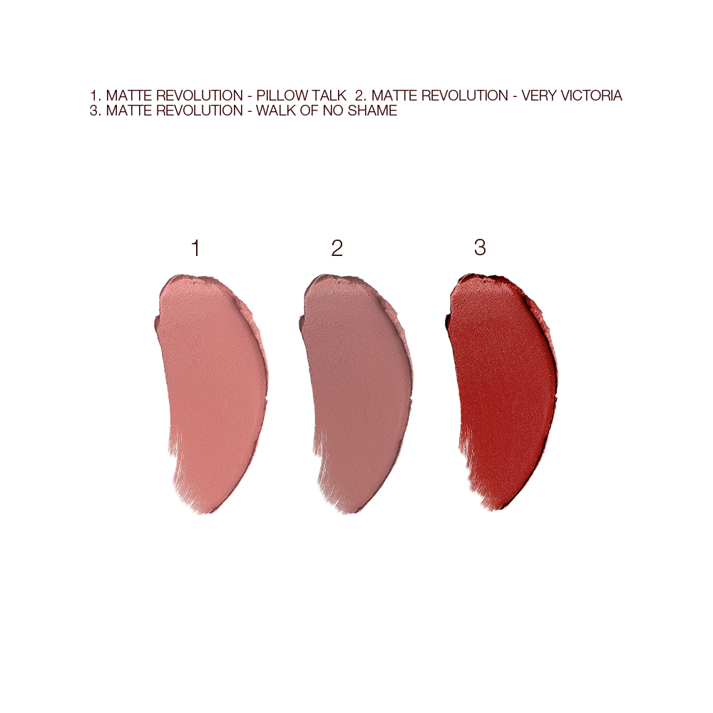 Swatches of three matte lipsticks in nude pink, pale pink, and berry-rose. 