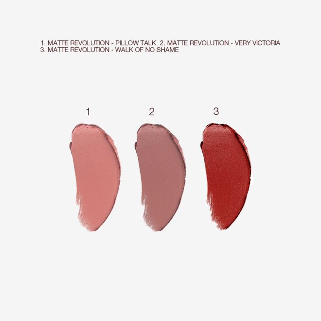 Charlotte's Iconic Mini Lip Wardrobe swatches Swatches of three matte lipsticks in nude pink, pale pink, and berry-rose.