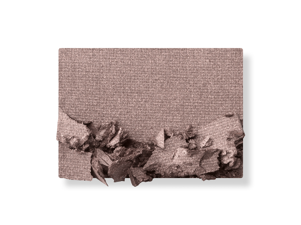 Swatch of a powder eyeshadow in a blush pink shade. 