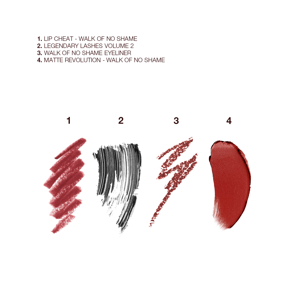 Swatches of an eyeliner pencil in a berry-pink shade, black mascara, lip liner pencil in a coppery russet shade, and lipstick in a berry-pink shade.