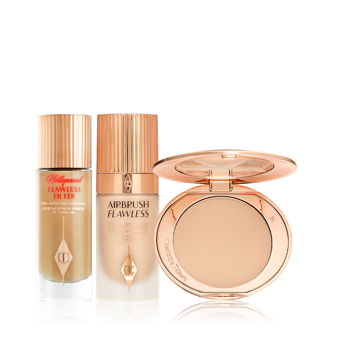 Highlighted Radiance kit displayed Glowy primer in a glass bottle with a gold-coloured-lid, foundation in a frosted glass bottle with a gold-coloured lid, and pressed powder compact with a mirrored-lid in a light shade.