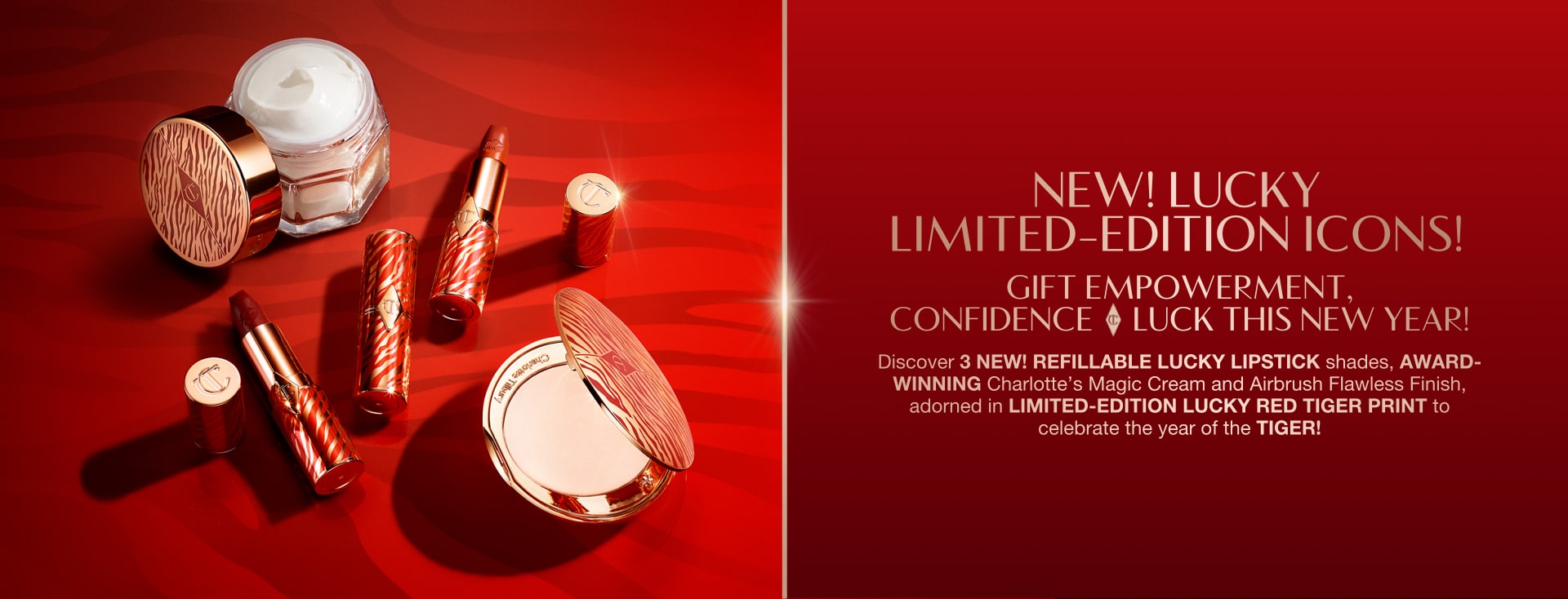 Red-coloured banner with an open jar of pearly-white white cream, open lipstick tubes, and an open pressed powder compact with a mirrored lid in gold packaging, all products having red-coloured tiger stripes on them for the Lunar New Year, along with text on the banner that reads, 'New! Lucky limited-edition icons! gift empowerment, confidence & luck this new year!'