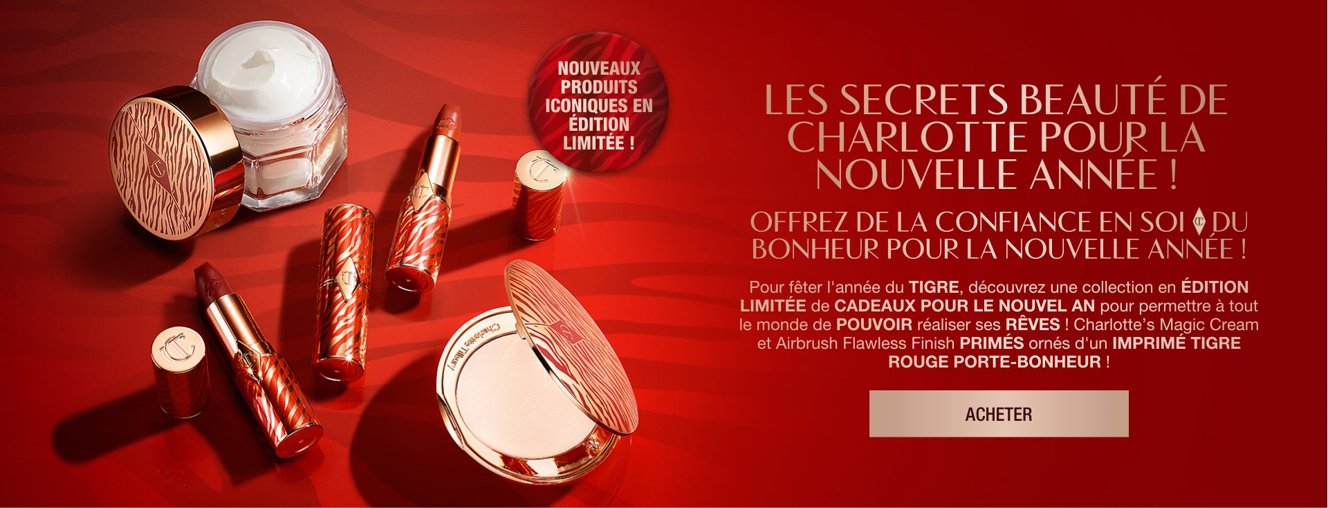 Red-coloured banner with an open jar of pearly-white white cream, open lipstick tubes, and an open pressed powder compact with a mirrored lid in gold packaging, all products having red-coloured tiger stripes on them for the Lunar New Year, along with text on the banner that reads, 'New! Lucky limited-edition icons! gift empowerment, confidence & luck this new year!'