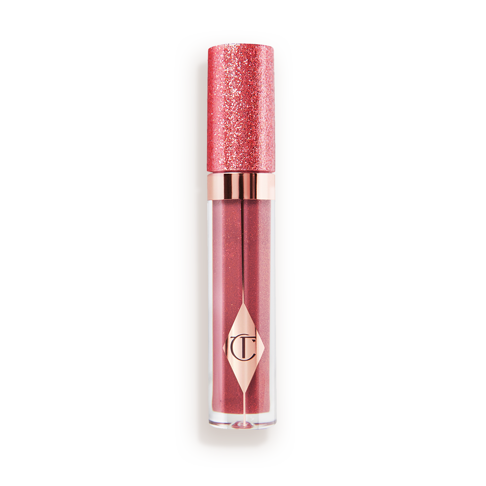 A berry-pink lip gloss in a glass tube with a shimmery strawberry-red lid. 