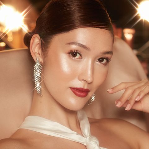 Aimee wearing a glowing prom makeup look