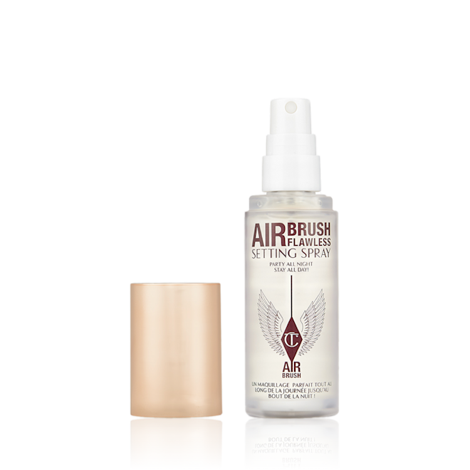 Airbrush Flawless Setting Spray Travel Size lid removed An open, travel-size setting spray in a clear bottle with a gold-coloured lid.