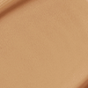 Close-up swatch of a skin-like, glowy foundation in a dark beige shade.
